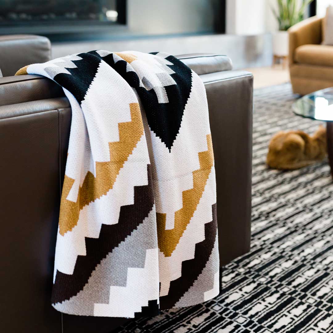 Seek & Swoon Homeland Throw. Bold stepped diamonds in ochre, black, and ivory, designed by Jennifer Berg.